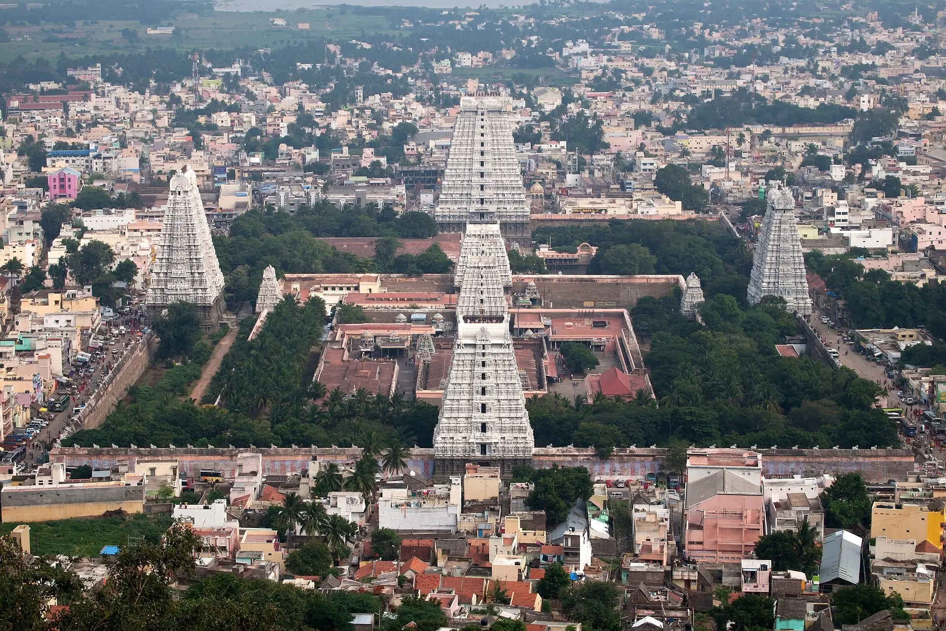 Arunachaleswarar Temple seen from Arunachala hill, with its white gopuram towers rising above Tiruvannamalai town